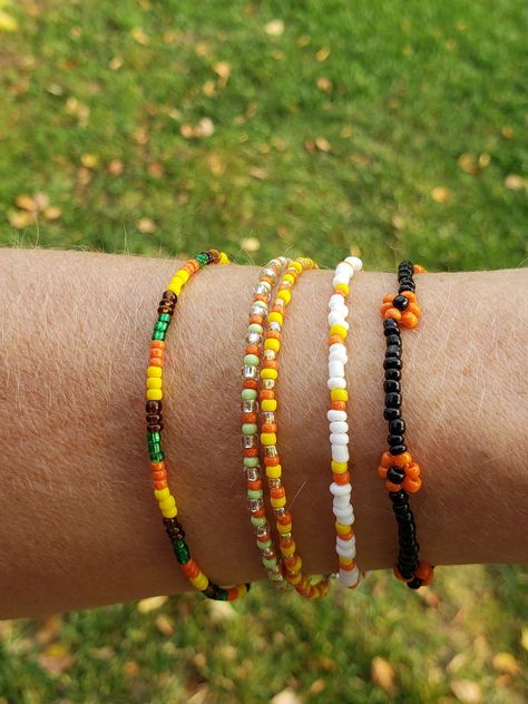 ~Autumn vibes~ collection 🍂  This collection features 10 fall-themed bracelets. They come in multiple sizes (if you don't see your size please contact me!) And are numbered on the pictures, so you make sure to get the right one! These dainty bracelets are perfect for the fall season and waiting for YOU to order ~ simplyradiantjewelry Red Wing Mn, Fall Bead, Holiday Bracelets, Autumn Bracelet, Halloween Bracelet, Bracelet Craft Diy, Diy Jewelry Unique, Bead Charms Diy, Diy Bracelets Patterns