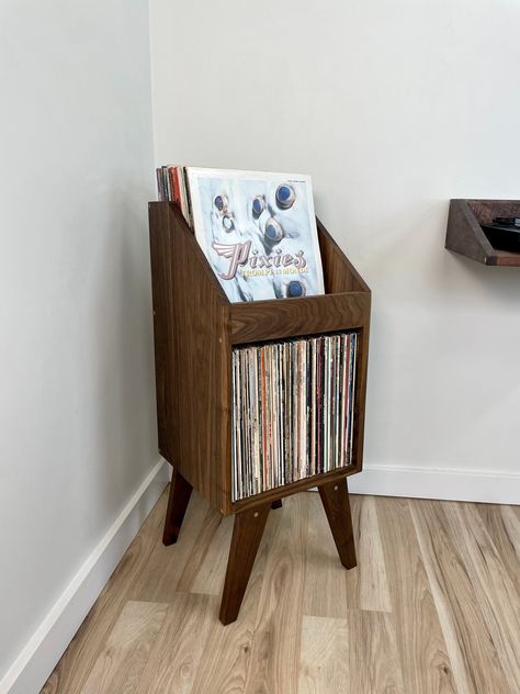 "Hand crafted record stand made with carefully selected hardwoods. We created this record storage stand to provide a more accessible option for people who are looking for handmade pieces and quality materials while still affordable. Hope you enjoy! Stores 140 records 34\" tall X 14.5\" wide X 13.75\"deep Featured item is walnut Each piece is handmade with carefully selected wood. Grain patterns vary, especially in soft maple and hard maple. If you have a piece to match or certain aesthetic pleas Front Flip, Woodworking Projects For Beginners, Vinyl Display, Record Stand, Vinyl Record Storage, Vinyl Storage, Record Storage, Storage Stand, Console And Sofa Tables