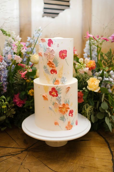 Spring Wedding Cake 2 Tier, Wedding Cake With Painted Flowers, Vibrant Color Wedding Cake, Simple Wedding Cake 2 Tier Flowers, Wedding Cakes With Icing Flowers, Wild Flower Cake Wedding, Bright Flower Wedding Cake, Simple Colorful Wedding Cake, Spring Wedding Cake Ideas Simple