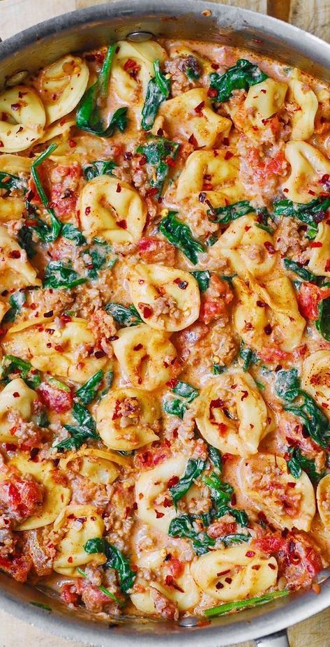 Creamy Tortellini with Sausage, Spinach, Tomatoes, and Mozzarella in a stainless steel skillet Tortellini With Sausage, Tortellini With Spinach, Mozzarella Cheese Sauce, Creamy Tortellini, Tomatoes And Mozzarella, Sausage Spinach, Spinach Tortellini, Sausage Tortellini, Tortellini Recipes