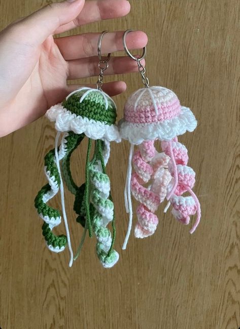 Handmade Jellyfish Crochet Keychain, Amigurumi Jellyfish, Cute Jellyfish Plush Toy Keychain, Mini Jellyfish Cute Gifts, Backpack Keychain CUTE JELLYFISH KEYCHAIN Materials: This lovely animal amigurumi is crocheted with cotton yarn Cute jellyfish keychain is meticulously handcrafted by hand This mini jellyfish amigurumi measures about 10cm in length CUTE GIFT FOR YOUR LOVERS If you are looking for a meaningful handmade gift, this little jellyfish keyring will be great choice to you.  It will be Crochet Animal Toys, Crochet Backpack Keychains, Crochet Friendship Keychains, Small Crochet Jellyfish, Crochet Jellyfish Keychain Free Pattern, Amigurumi Crochet Keychain, Small Gifts Crochet, Crochet Keychain Mushroom, Simple Easy Crochet Projects