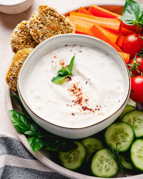 This tahini yogurt sauce is our go-to sauce and dip! It's irresistibly creamy and takes just 2 minutes to whip up. We like using it as a sauce for grilled vegetables, chicken, or seafood, or topping it with tomato confit as a tasty appetizer. #tahinisauce #yogurtsauce #tahiniyogurtsauce #yogurttahinisauce #easytahinisauce #tahinirecipe #yogurtdip #tahinidip #easyrecipe #easydip Tomato Confit, Best Fish Recipes, Winter Salad Recipes, Tahini Recipe, A Couple Cooks, Couple Cooking, Vegan Salad Recipes, Best Vegetarian Recipes, Vegetarian Appetizers