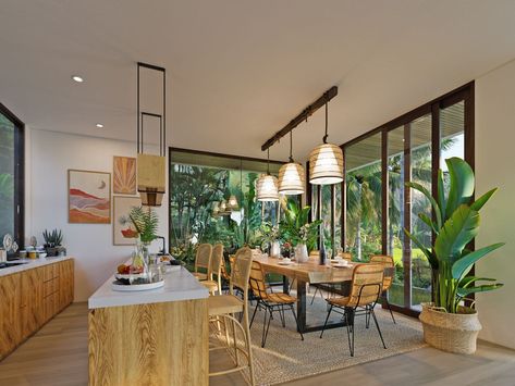 Styled in tropical design, this area offers vibrant aesthetics through the use of rattan chairs, unique pendant lamps, and indoor plants. Its spacious feel is supported by the open-plan layout that blurs the boundaries between the areas, allowing natural light in. Beautiful design by Balitecture for The Kayu in Bali, Indonesia. Tropical Kitchen Design, Chairs Unique, Tropical Kitchen, Tropical House Design, Kitchen And Dining Area, Open Concept Layout, House In Nature, Tropical House, Modern Houses Interior