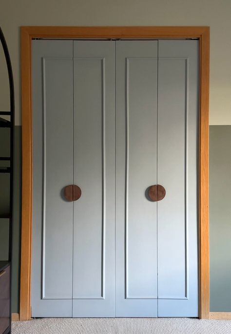 Learn how to give an old folding door a new completely new modern look with this DIY Closet Doors under $50 post!  A fresh coat of paint, adding some decorative trim molding and modern circular doorknob hardware gives your closet a fresh budget friendly feel.  Delineate Your Dwelling Diy Closet Door Upgrade, Replacing Folding Closet Doors, Trim On Closet Doors, Bedroom Door Upgrade, Refinish Bifold Closet Doors, Remodel Closet Doors, Bifold Door Makeover To French Doors, Fun Interior Doors, Upgrading Sliding Closet Doors