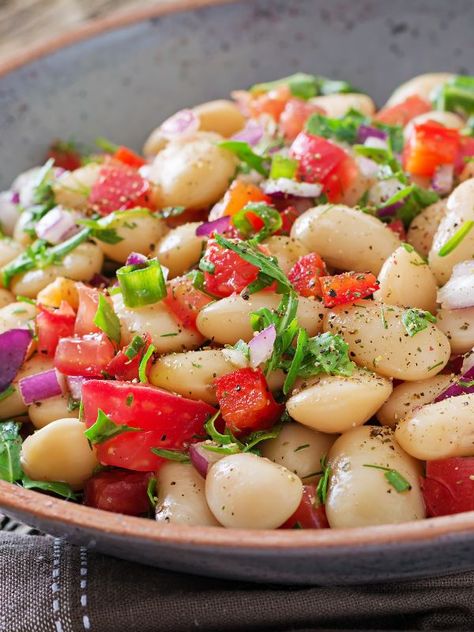 Do you want to try the best Warm Spanish Bean Salad Recipe? The white bean salad is the perfect winter salad for it's also nutritious and healthy but it's also a warm salad. This Spanish white bean salad is incredibly easy to make, requires few ingredients and it's very low-fat, so it's a great choice while you're on a diet. So if Spanish traditional salad recipes you're after, don't hesitate to try the comforting Spanish bean salad. #spanishbeansalad #beansalad #warmbeansalad #spanishsalads Lima Bean Salad Cold, Spanish Fruit Salad, White Bean Salad Recipes Healthy, Spanish Salad Recipes, Spanish Salads, Spanish Meal, Bean Salad Recipes Healthy, Spanish Salad, Spanish Beans