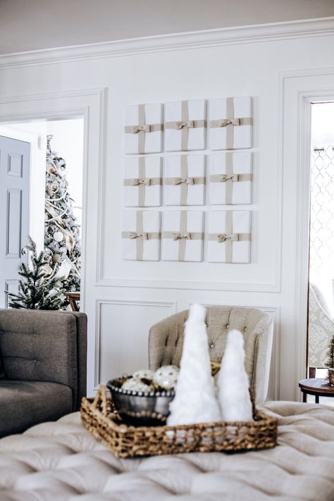 DIY Christmas Tutorial: Wrapped Picture Frames Sweetwood Creative Co. | Atlanta Wedding Planner + Upscale Event Design Wrapped Frames On Wall Christmas, Wrapped Picture Frames Christmas, Wrapping Paper Wall Decor, Wrapping Paper On Walls Christmas, Pictures Wrapped As Presents On Wall, Christmas Wrapped Pictures On Wall, Wrapping Pictures On Wall Christmas, Big Picture Frames, Giant House