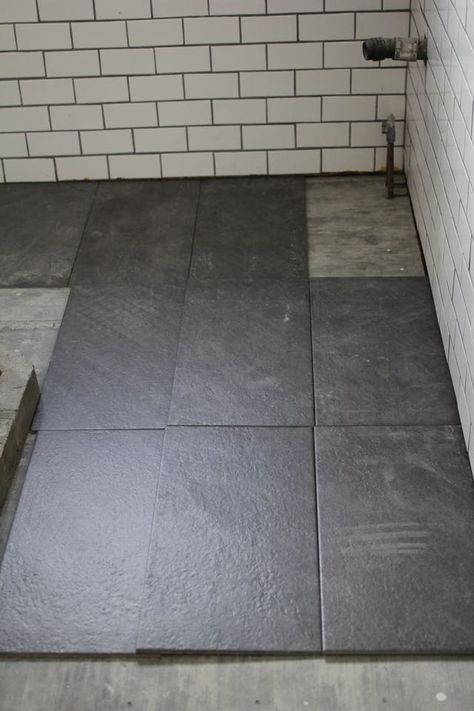 For my bathroom renovation, I finally decided on large slate tiles for the bathroom floor Slate Bathroom Floor, Black Tile Bathroom Floor, Dark Tile Floors, Slate Bathroom, Black Tile Bathrooms, Slate Tile Floor, Small Bathroom Tiles, Custom Tile Shower, Black Floor Tiles