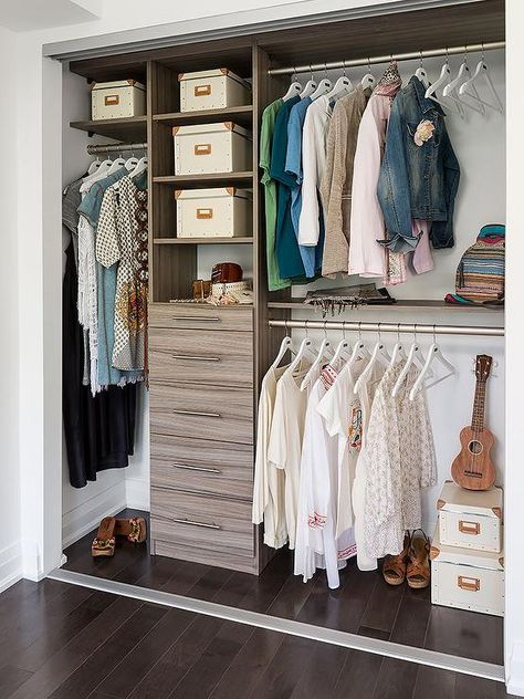 Condo closet features modular brown melamine shelving units and chest of drawers next to stacked clothes rails. Condo Closet, Transitional Closet, Window Paint, Closet Storage Systems, Closet Clothes Storage, Modular Closets, Baby Closet Organization, Reach In Closet, Classic Closet