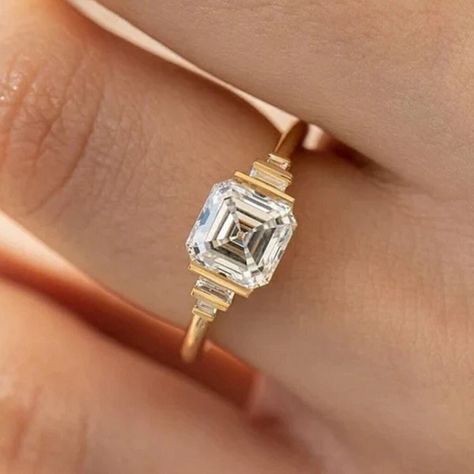 Delicate 2.50 CT Asscher Cut Wedding Ring * Colorless Moissanite Ring * 14k/18k Yellow Gold * Classy Lower Sitting * Bar Setting * Baguettes ❤ ITEM DETAILS:- ✦ Brand: The American Gold House (TAGH) ✦ Handmade, high-quality item! ✦ Material: Solid 10K/14K/18K Gold, 950 Platinum and 925 Sterling Silver ✦ Diamond Type: Moissanite Diamond ✦ Diamond Cut: 7.5 MM Asscher  ✦ Diamond Weight: 2.50 CT ✦ Main Stone Color: Colorless ✦ Width of Band: 1.8 MM (Bottom) ✦ Diamond Clarity: VVS/VS ❤ ACCENT/HALO DIAMONDS:- ✦ Side Stone Material: Moissanite Diamond ✦ Side Stone Shape: Baguette Cut ✦ Side Stone Carat Weight: 0.30 CT (Approx.) ✦ Side Stone Color: Colorless ✦ Diamond Clarity: VVS/VS   ------------------------------------------------------------------------------ 💎 Moissanite VS Diamond 💎 ------- Half Bezel Ring, Gold House, Moissanite Vs Diamond, Bar Setting, Asscher Diamond, Colorless Diamond, Bezel Ring, Stone Material, Moissanite Wedding Rings