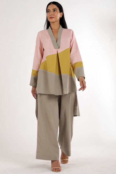 Featuring a multi-colored tunic in cotton base. It is paired with matching grey pants.  FIT: Fitted at bust and waist. COMPOSITION: Cotton. CARE: Cold wash using a mild soap. Dry in the shade. Do not use bleach or chlorine, or hard detergents. Cotton Tunics For Women, Long Kurti Patterns, Traditional Ideas, Co Ords Outfits, Sets Outfit, Color Plain, Tunic Designs, Cotton Kurti Designs, Kurta Designs Women