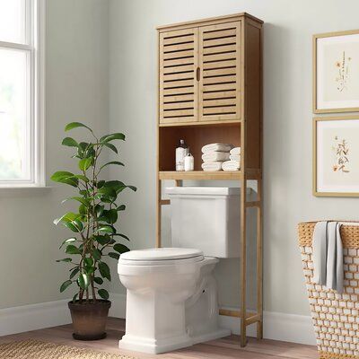 The humanized design of the bamboo storage shelf makes reasonable use of space and perfectly solves the storage problem. It is made of bamboo, strong and durable, and attractive in any home. The device has an open area for easy access to toilet paper, soap, or other bathroom necessities. The design of the cabinet doors makes the space look neater. The toilet stand is your ideal choice. | Rebrilliant 24.4" W x 67" H x 9.4" D Solid Wood Over-The-Toilet Storage Brown/Yellow 66.9 x 24.3 x 9.3 in | O Over Toilet Storage Cabinet, Over The Toilet Rack, Over Toilet Storage, Over The Toilet Storage, Bathroom Space Saver, Toilet Shelves, Over The Toilet, Bamboo Bathroom, Apartment Decoration