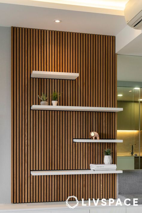 wooden-panel-design-that-also-works-as-display-unit Office Slat Wall, Living Room Wood Panel, Accent Wall Shelf, Wooden Partition Design, Wooden Panel Design, Panels For Walls, Wooden Wall Design, Wood Wall Design, Esthetician Room Decor