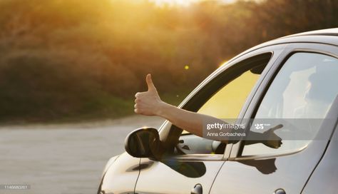 Stock Photo : Man showing thumbs up from car window at sunset Student Driver, Winter Drink, Dubai Cars, Driving School, Premium Cars, Car Hire, Rent A Car, Driving Test, Car Buying