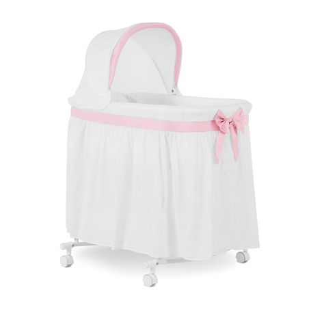 PRICES MAY VARY. ULTIMATE FLEXIBILITY: This innovative bassinet offers two modes of use, serving as both a bassinet and a cradle. With the ability to rotate the wheels, you can transform it into a cradle, gently rocking your little one to sleep with soothing motions. MAXIMUM PORTABILITY: With lockable wheels that ensure stability & glide effortlessly, you can easily move the bassinet from one room to another, keeping your baby close by at all times. USEFUL STORAGE: Equipped with a spacious botto Bedside Bassinet, Portable Bassinet, Bed Bassinet, Large Storage Baskets, Toddler Beds, Baby Bassinet, Delta Children, Storage Area