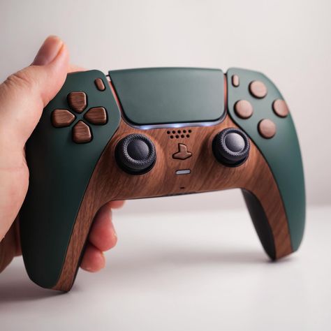 Some more earth tones. #ps5games #ps5controller #ps5 #playstation5 #playstation5games #playstation5controller #ps #ps4 #ps2 #earthtones #cozygaming Nature Themed Gaming Setup, Nature Gaming Setup, Pc Game Room, Cool Game Room Ideas, Game Controller Storage, Ps5 Setup, Custom Ps5 Controller, Cozy Gaming Setup, Nerdy Decor