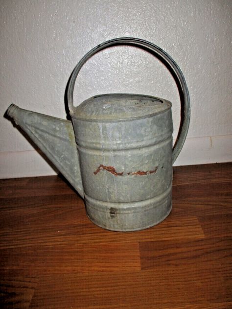 Vintage~Galvanized Watering Can~13.75" x 7.75"~Rustic~Planter~Yard Art~1960's~This large watering can is in good condition, no leaks, no holes, and has been stored in a gardening shed for quite a few years. It could also be used as yard/fence art, planter,birdhouse, intended purpose, repurposed, etc. Measure 13.75" tall, 7.75" across the base, and from side of handle to outer side of spout measures approx. 14.0". Please view all photos and enlarge photos for additional details. Thank you! Antique Knowledge, Garden Shed Interiors, Primitive Rustic Decor, Vintage Kitchen Gadgets, Rustic Planter, Galvanized Decor, Antique Boutique, Vintage Glassware Antiques, Rusty Garden