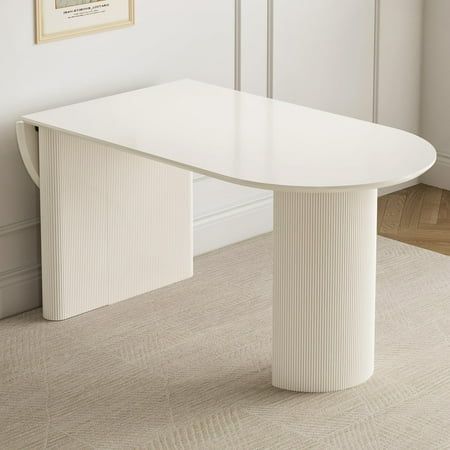 Enhance your dining area with the QEZEOM Folding Dining Table, a versatile and space-saving solution designed to accommodate 4 to 8 people. This modern rectangle dining table in white is perfect for kitchens and small dining rooms, offering flexibility with its foldable design. Whether hosting a family dinner or entertaining guests, this table expands effortlessly to meet your needs while maintaining a sleek and contemporary appearance. Dining Table Desk Combo, Table That Folds Down From Wall, Dining Table Attached To Kitchen Island, Small Kitchen Nook Table, Dining Table Studio Apartment, Table That Expands, Island And Dining Table Combo, Kitchen Table Ideas For Small Spaces, Fold Down Kitchen Table