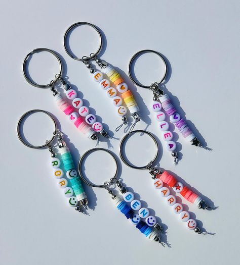 These fun and colourful Heishi polymer clay bead keyrings are available with assorted acrylic spacer beads.  Choose from star, heart or smiley face. Each design is handmade to order with your choice of name and spacer bead. Personalised name will be colour coordinated with the colour of Heishi beads chosen.  There are also matching bracelets available in our shop.