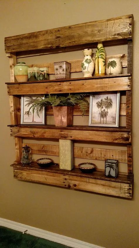 a large rustic pallet shelf stained, with photos, vases and candles on display for a rustic or vintage rustic space Pallet Projects Laundry Room, Floating Shelves Pallet Wood, Pallet Shelving Ideas, Pallet Board Shelves, Pallet Shelves Diy Wall Shelves, Pallet Trim Ideas, Wall Pallet Ideas, Pallet Floating Shelves, Pallet Board Projects