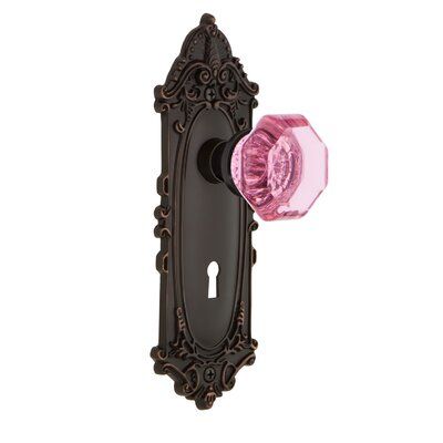 The Waldorf Privacy Door Knob with Victorian Plate with its distinct curvilinear embellishment is unmistakably old world vogue. Pair this with Nostalgic Warehouse Waldorf Door Knob and its crisp clean edges for a lucent look. All Nostalgic Warehouse door knobs are mounted on a solid (not plated) forged brass base for durability and beauty. Finish: Timeless Bronze, Backset: 2-3/4” | Nostalgic Warehouse Pink Crystal Waldorf Privacy Door Knob w / Keyhole Victorian Long Plate in Brown, Size 8.25 H x Waldorf Interior, Crystal Door Knobs, Privacy Door, Pink Door, Goth Home, Goth Home Decor, Gothic Home Decor, Gothic House, Knobs And Handles