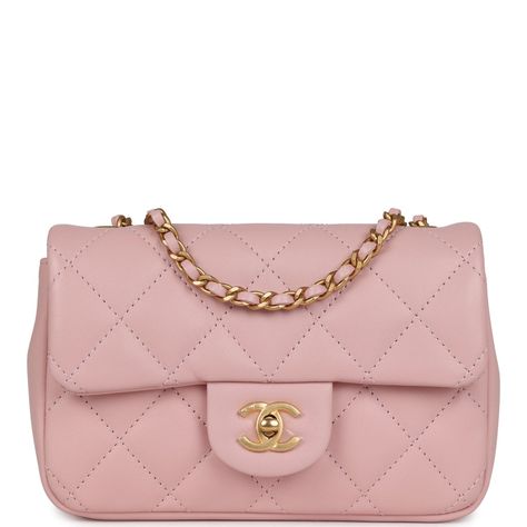 This Mini Rectangular flap bag is of pink lambskin leather with antique gold tone hardware and has a front flap with signature CC turnlock closure, rear half moon pocket, single interwoven rose leather and antique gold tone chain link shoulder/crossbody strap with heart charms.The interior is lined in pink leather and features an open pocket.Collection: 22B (RFID Chip)Origin: ItalyCondition: New and never wornAccompanied by: Chanel box, Chanel dustbag, ribbon, and carebookMeasurements: 7.5" width x 4.7" height x 2.5" depth; 22.5" strap drop Chanel Pink Bag, Handbags Aesthetic, Chanel Mini Rectangular, Pink Handbag, Chanel Box, Chanel Mini, Heart Chain, Pretty Bags, Handbag Wallet