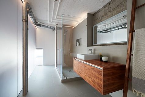 Lake Calhoun Organic Modern Modern Home in Minneapolis, Minnesota on Dwell Floor Ceramic, Ceramic Tile Floor, Glass Blocks Wall, Ceramic Tile Wall, Elevated Home, Ice House, Lighting Photo, Concrete Column, Wall Mount Sink