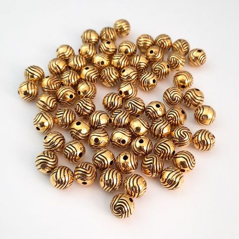 Acrylic Beads 8mm Round Design #25 - Rs. 80 for 66 Beads . Bead Size: Approx 8mm diameter Beading Length: Approx 8mm Hole Diameter: Approx 1.5mm Shape: Round Material: Acrylic/ Plastic Quantity: 66 beads in a pack Colour/s: Antique Gold* . Our antique golden finish acrylic beads combine the lightweight convenience of acrylic with the luxurious appeal of gold, making them the perfect addition to any design. Moreover, we have them in a range of shapes and design which are bound to add a touch o... Beaded Necklace Designs, Acrylic Plastic, Round Design, Acrylic Beads, Necklace Designs, Antique Gold, Beading, Beaded Necklace, Range