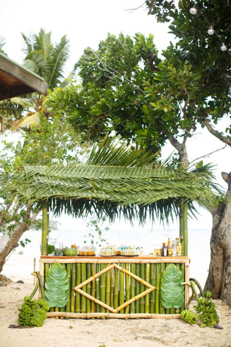 rainforest beach wedding bar aesthetic Tropical Bar Design, Beach Wedding Bar, Event Entrance Design, Tiki Wedding, Tropical Bar, Event Entrance, Beach Wedding Decorations Reception, Bamboo House Design, Tropical Beach Wedding