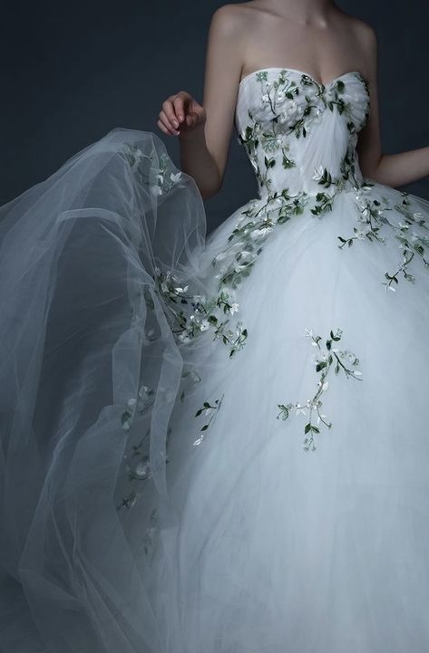 White Wedding Dress With Green Detail, Floral Train Wedding Dress, Non Tradition Wedding Dresses, Forest Green And White Wedding Dress, White Wedding Dress With Green Lace, Soft Wedding Dress Romantic, Wedding Dress With Green Accents, Wedding Dress With Green Vines, Wedding Dresses With Green Accents