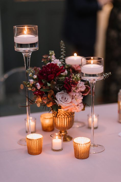 I love thinking about how the candle flames will light up those centerpieces when the sun has set. With those deep reds and pinks, it will surely create a deeply romantic night. ⁠ Table Centerpieces For Dinner Party, Pink Candle Centerpieces, Candle And Flower Centerpieces, Wedding Centerpieces Small, Floral Table Decor, Red Candle Holders, Candlelit Wedding, Candle Table Centerpieces, Floating Candle Centerpieces