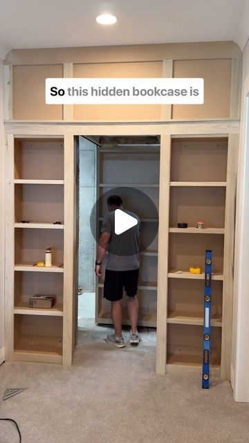 MT Trim Co. on Instagram: "This hidden bookcase door is on another level! It’s literally hanging from tracks that help it glide completely in and out of the opening! 

#hiddendoor #bookcase #slidingdoors #carpentryskills #interiortrim #customcabinets #slide #builtins" Built In Bookshelves With Hidden Door, Built Ins With Secret Door, Hidden Christmas Tree Closet, Bookshelf Door Diy, Hidden Book Shelf, Hidden Bookshelf Door, Billy Bookcase With Doors, Hidden Bookcase Door, Diy Bookshelf Wall