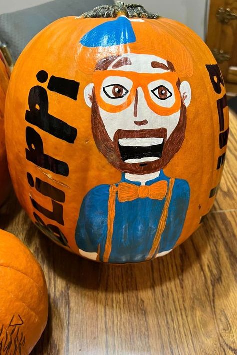 pumpkin painted with Blippi on it with orange and blue Blippi Pumpkin, Fun Pumpkins, Pumpkin Carvings Stencils, Halloween Pumpkin, Pumpkin Carving, Halloween Pumpkins, Carving, Halloween