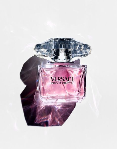 Bright Crystal perfume by Versace was inspired by a mixture of Donatella Versace's favorite floral fragrances, Bright Crystal is a fresh, sensual blend of refreshing chilled yuzu and pomegranate mingled with soothing blossoms of peony, magnolia, and lotus flower, warmed with notes of musk and amber. Notes include Iced Accord, Yuzu, Pomegranate, Peony, Magnolia, Lotus Flower, Acajou, Vegetal Amber, Musk. Decant Perfume, Versace Perfume, Fragrance Photography, Versace Bright Crystal, Bright Crystal, Perfume Photography, Still Life Photographers, Perfume Scents, Perfume Lover