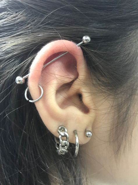 Industrial piercings helix Ear Stacking Ideas Grunge, Loads Of Ear Piercings, Spiked Helix Piercing, Alt Piercings Ear, Both Ears Pierced Ideas, Ear Piercings Helix Hoop, Alt Ear Piercings, Grunge Earrings Piercings, Punk Ear Piercings