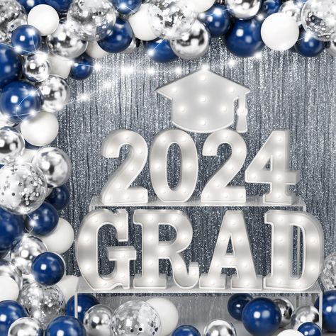 PRICES MAY VARY. 79 PCS GRADUATION PARTY FAVOR DECOR: Qinline 2024 graduation party decorations set includes 8 LED marquee light up letters “2024 GRAD” (NOT BATTERIES INCLUDED), 1 LED 'Doctoral hat', 16 X 10” midnight blue balloon, 16 X 10” sliver latex balloon, 10 X 10” white balloon, 10 X 12” sequins balloon, 2 foil curtain backdrop(3.3 x 6.7tf), 4 installation tools, 4 warm white led light strings. Add an element of fun to your party by using Qinline graduation light up table ornaments decora Boy Graduation Party Decorations, Blue And Silver Graduation Decorations, Graduation Party Ideas Blue And White, Blue And White Graduation Party Ideas, Blue And Silver Decorations, Graduation Decoration Ideas, Garage Party Decorations, Middle School Graduation Party, Graduation Party Decoration Ideas