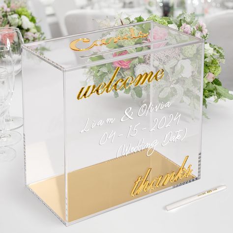 PRICES MAY VARY. ELEGENT WEDDING CARD BOX: This modern crystal-clear acrylic card box with gold mirror accents is a stunning decoration that captures your guests' attention while efficiently collecting gift cards, cash, checks, and small-sized gifts. HIGH QUALITY ACRYLIC: Crafted from premium 4mm thick cast acrylic with gold mirror prints of "cards, welcome, thanks." Large storage capacity holds 80-100 cards. Measurements: 10x10x5.5 inches. Slide-off top lid with a 7-inch slot. Securely packed w Gift Card Box Wedding, Box For Cards At Party, Sweet 16 Card Box Ideas, Gold Card Box, Acrylic Card, Money Box Wedding, Wedding Card Box, Gift Card Boxes, Clear Box