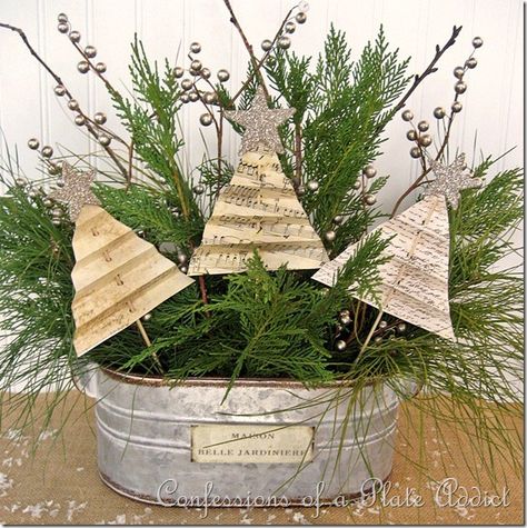 Old book pages repurposed into simple but elegant Christmas decorations planted into a galvanized wash tub filled with live greens.  Simply charming. Natal Country, Shabby Chic Christmas Decorations, Paper Trees, Chic Christmas Decor, Tree Tutorial, French Accent, Shabby Christmas, Christmas Crafts For Adults, Christmas Centerpieces Diy