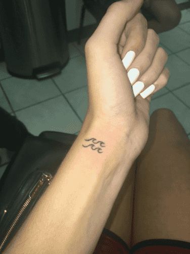 25 Best Aquarius Tattoo Ideas And Zodiac Sign Tattoos With Meanings | YourTango Aquarius Tattoo, Shape Tattoo, Zodiac Sign Tattoos, Zodiac Tattoos, Constellation Tattoos, Unique Tattoo Designs, Minimalist Tattoos, Subtle Tattoos, Aquarius Zodiac