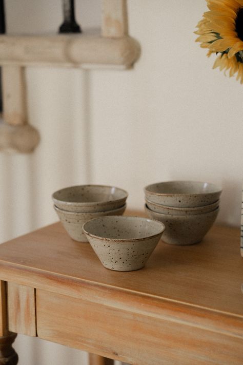 These bowls are your reliable companion, whether it's morning granola, a hearty serving from the stove, or a late-night snack. Designed for convenience, they stack effortlessly and store neatly. Made from durable stoneware and adorned with a lustrous white glaze, each saucer is meticulously handcrafted on the potter's wheel, ensuring a unique touch to every piece. Each bowl is organically shaped and one of a kind. All items are dishwasher safe, but highly recommend handwashing with care to preserve their craftsmanship. Since each piece is individually crafted on the wheel, expect slight variations in size, shape, or color between the products and the images displayed. Bowl Ceramic Design, Minimalist Breakfast, Wheel Ceramics, Pottery Photography, Ceramic Minimalist, Pottery Unique, Ceramics Pottery Bowls, Ceramic Serving Bowl, Pottery Inspo