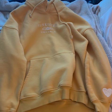 This Is A Yellow Sunkissed Coconut Hoodie A Size Large And Has Never Been Worn! Coconut Clothes, Sunkissed Coconut, Beach Hoodie, Preppy Outfits, Coconut, Yellow, Women Shopping, Clothes, Color