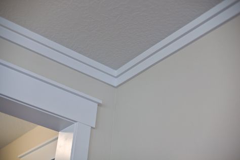 Love the simple lines of the "crown" and the way it goes perfectly with the simple craftsman door trim!!  Taken from a blog "Tidbits from the Tremaynes" Modern Crown Molding, Real Crown, Simple Crown, Ceiling Crown Molding, Baseboard Styles, Craftsman Trim, Diy Home Decor For Apartments, Ceiling Trim, Craftsman Door