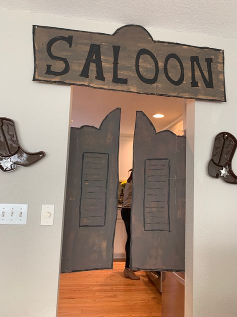 Cardboard Saloon Doors, Wild West Door Decorations, Cowboy Theme Birthday Party Decorations, Western Dance Ideas, Wild West Classroom Door Ideas, Western Hallway Decor School, Wild West School Theme, Diy Saloon Doors Cardboard Western Theme, Boots And Beauties Dance Decor