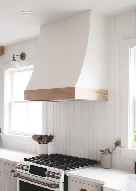 Learn how to build this white and wood curved range hood cover! #diy #kitchenremodel #rangehood Range Hood Cover Modern, Angled Range Hood, Undercabinet Range Hood, Wooden Hoods Over Stove, Range Hood Cover Diy, Range Hood Cover Ideas, Curved Range Hood, Diy Range Hood Cover, Wood Hood Vent