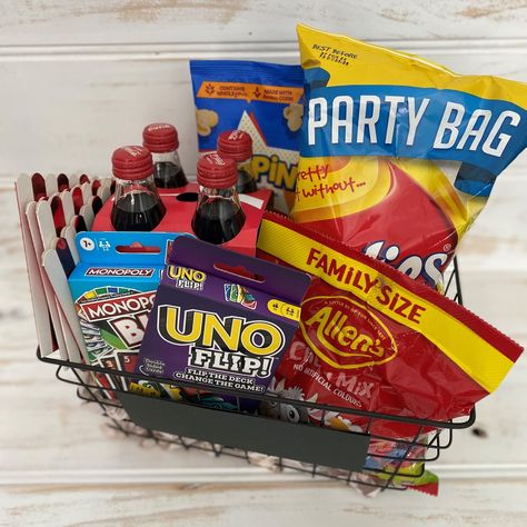 Family Game Night Gift Basket. A great gift for the whole family to enjoy. Three basket options to choose from: Small Basket Includes: 2x Card Games (Uno Flip & Monopoly Bid), Large Chips, Allens Chews, Microwave Popcorn, 4pk Coca-Cola or 1x 1.25L Coca-Cola. Whilst all food and beverage items will be purchased within 24-48hrs of your purchase to ensure they are as fresh as possible, we do not take responsibility of any issues within sealed packaging. Medium Basket Includes: Card Game (Skip-Bo), Family Night Basket, Family Game Night Gift Basket, Game Night Gift Basket, Game Basket, Family Gift Baskets, Game Night Gift, Auction Baskets, Uno Card Game, Microwave Popcorn