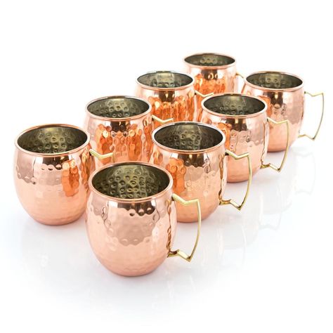 The Gibson Elite Mule Mixer 8-Piece 18 oz. Hammered Brass Copper Cup Set is perfect for any grand get-together with friends. There is nothing a like a cold refreshing Mule in a stunning brass copper mug. The hammered texture oozes eye catching style while providing long lasting quality. The brass construction helps maintain cool temperatures longer for better enjoyment. Serve a large assortment of mixed cocktails, juices or cold desserts. Best Moscow Mule, Moscow Mule Cups, Mule Mugs, Copper Mug, Copper Moscow Mule Mugs, Copper Cups, Drinking Glass Sets, Copper Mugs, Moscow Mule