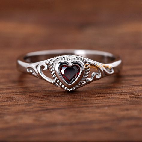 Solid 925 Sterling Silver 4mm January Birthstone Dark Red Garnet Color Heart CZ Bezel Set Rope Filigree Baby Girls Childrens Teens Ring ▷Gift Box Included ▷7mm Height ▷Size 1 - 12 Available ▷925 Sterling Silver (not plated or filled) ▷925 Stamp Authenticity ▷High-Quality Cubic Zirconia Used https://www.etsy.com/shop/TrendyRing Dark Red Ring, Teen Ring, Grandma Jewelry, Garnet Color, Edgy Earrings, Edgy Jewelry, Color Heart, Dope Jewelry, January Birthstone