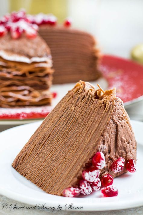 This beautiful chocolate mousse crepe cake is made of 20+ layers of delicate chocolate crepes filled with rich chocolate mousse filling and topped with festive red pomegranates. Rich Chocolate Mousse, Chocolate Mousse Filling, Dessert Crepes, Crepe Cake Recipe, Mousse Filling, Crepes Filling, Chocolate Crepes, Kolaci I Torte, Crepe Cake