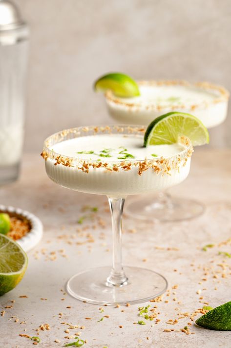 Incredible 4-ingredient coconut margarita made perfectly sweet, tart, and creamy with fresh lime juice and coconut milk. Top your glass with toasted shredded coconut for an extra tropical flavor, and enjoy this fun twist on a classic margarita recipe! The best cocktail for the beach, pool, or patio hangouts. Coconut Milk Cocktail, Coconut Margarita Recipe, Lime Cocktail Recipes, Coconut Manna, Classic Margarita Recipe, Dips And Spreads, Coconut Margarita, Margarita Ingredients, Lime Margarita