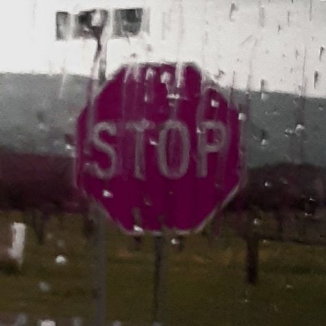 A photo of a red stop sign taken through a window with rain on it. Stop Sign, Eve Parties, In The Rain, Christmas Eve, The Rain, Collage, Signs, Christmas, Pins