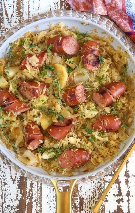 Kielbasa and Sauerkraut with Apples and Caramelized Onions - The Suburban Soapbox Baked Kielbasa, Sauerkraut With Apples, Kielbasa And Sauerkraut, Kielbasa Recipe, Kielbasa Recipes, Kielbasa Sausage, Sauerkraut Recipes, Apple Sausage, Sausage Casserole